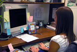 A student assistant in the Cataloging Department works to provide access through KentLINK to a new DVD.