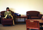 A student does homework in the newly remodeled study area on the first floor of the Main Library