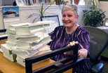 A Technical Services staff member readies a shipment of government documents for a trip to our commercial bindery.