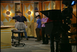 A Teleproductions staff member instructs students during studio production training.