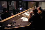 Staff and student employees in the Teleproductions control room working on an in-studio production.