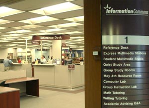 Information Commons Reference Desk and list of 1st floor services in the Main Library